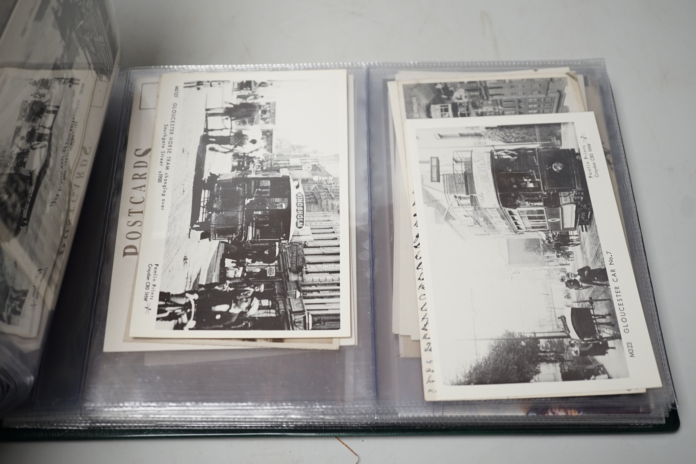 Postcards in three albums, to include themes, transport, theatre and topographical